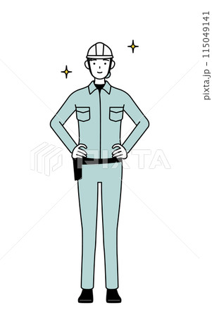 両手を腰に当てたヘルメットと作業着姿の女性技師 115049141