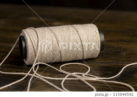 thin cotton thread for use in cooking 115049592