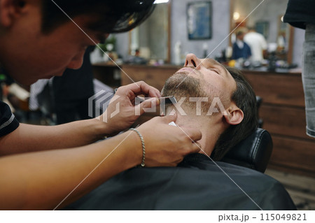 Barber Using Shavette Straight Razor Barber Using Shavette Straight Razor 115049821
