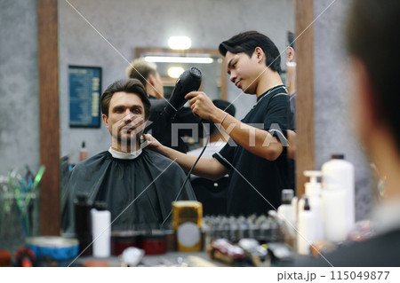 Barber Blowing Cut Hair off Neck 115049877