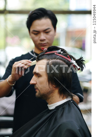 Barber Trimming Long Hair 115049944