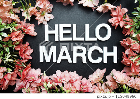 Hello March alphabet letter with flower decoration on black background Hello March alphabet letter with flower decoration on black background 115049960