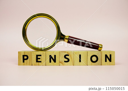 Pension with wooden blocks alphabet letters and Magnifying glass on pink background 115050015