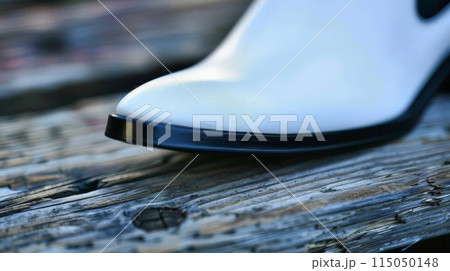 Close-Up of White Leather Shoe on Wood 115050148