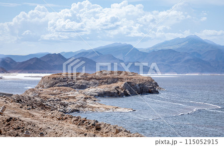 Lac Assal salt lake waters with islands in the middle, the lowest point of Africa, Tadjourah Region, Djibouti Lac Assal salt lake waters with islands in the middle, the lowest point of Africa, Tadjourah Region, Djibouti 115052915