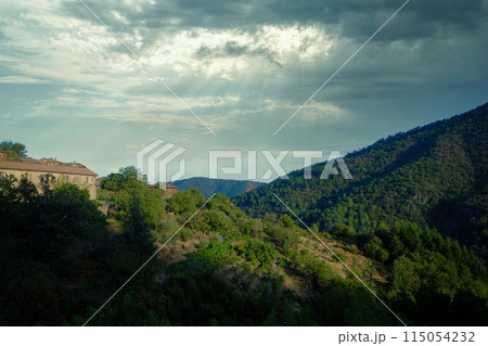 Picture serene mountain scenery with sunny clouds, green hills, and rustic nature beauty 115054232