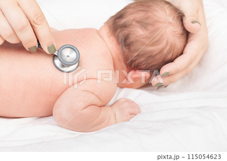 Doctor Examining Newborn with Stethoscope 115054623
