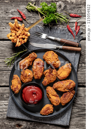 american style fried chicken wings on a plate american style fried chicken wings on a plate 115054922