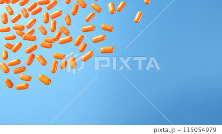 Yellow orange pills, capsules and vitamins in a jar on a blue background. 115054979