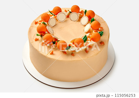 Orange-themed honey cake with whipped sour cream and chocolate decoration Orange-themed honey cake with whipped sour cream and chocolate decoration 115056253