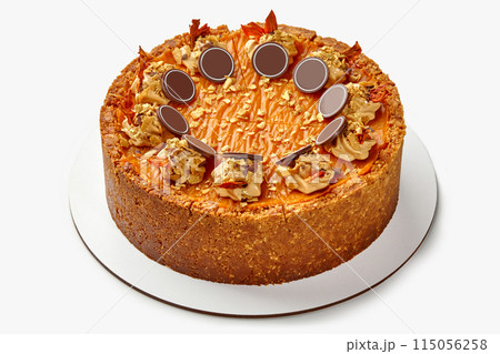 Pumpkin cheesecake with shortcrust nut base and sweet caramel 115056258