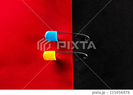Ukrainian symbols. Red and black flag. Red and black leaf. Yellow and blue pins. 115056978