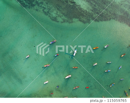 Aerial drone bird's eye view photo Top down of tropical sea with long tail fishing boats Travel boats at phuket thailand, Amazing top view sea nature landscape Aerial drone bird's eye view photo Top down of tropical sea with long tail fishing boats Travel boats at phuket thailand, Amazing top view sea nature landscape 115059765