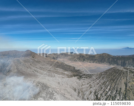 Aerial view Mountains at Bromo volcano during sunny sky,Beautiful Mountains Penanjakan in Bromo Tengger Semeru National Park,East Java,Indonesia.Nature landscape background Aerial view Mountains at Bromo volcano during sunny sky,Beautiful Mountains Penanjakan in Bromo Tengger Semeru National Park,East Java,Indonesia.Nature landscape background 115059830