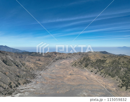 Aerial view Mountains at Bromo volcano during sunny sky,Beautiful Mountains Penanjakan in Bromo Tengger Semeru National Park,East Java,Indonesia.Nature landscape background 115059832