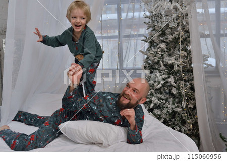 A large family with children posing in pajamas in New Year's locations. 115060956