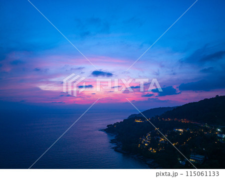 aerial view sweet pink Sunset is accompanied by clouds floating over the sea.. aerial view sweet pink Sunset is accompanied by clouds floating over the sea.. 115061133