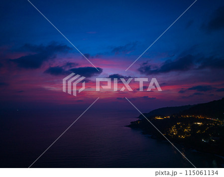 aerial view sweet pink Sunset is accompanied by clouds floating over the sea.. aerial view sweet pink Sunset is accompanied by clouds floating over the sea.. 115061134