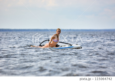 Happy windsurfer on the board Happy windsurfer on the board 115064742