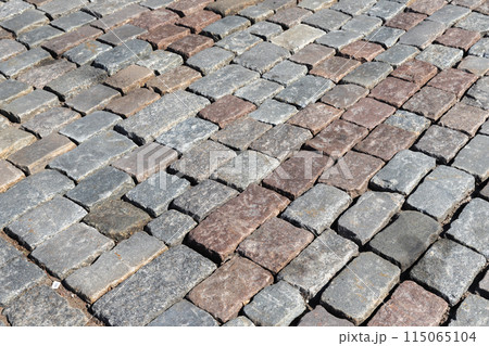 Background texture of an old cobblestone road Background texture of an old cobblestone road 115065104