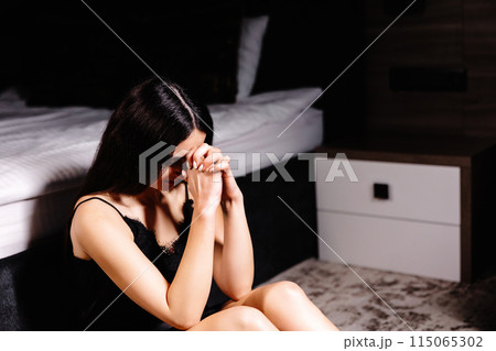 Unhappy woman touching hair, sitting on floor at home, thinking about problems. Upset girl feeling lonely and sad, psychological and mental troubles, suffering from bad relationship or break up Unhappy woman touching hair, sitting on floor at home, thinking about problems. Upset girl feeling lonely and sad, psychological and mental troubles, suffering from bad relationship or break up 115065302