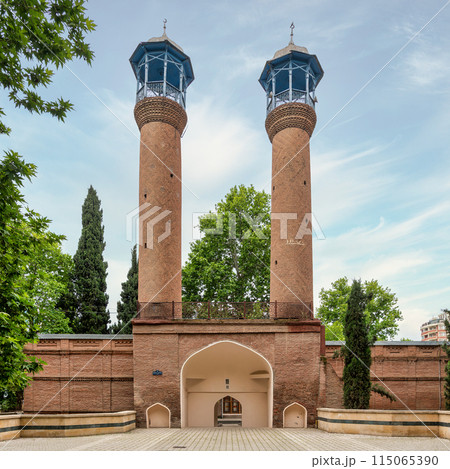 Juma Mosque of Ganja, Azerbaijan, with its two tall minarets and red bricks facade Juma Mosque of Ganja, Azerbaijan, with its two tall minarets and red bricks facade 115065390