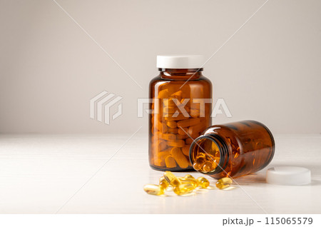 Brown glass bottle with vitamins food supplement, health and wellness 115065579