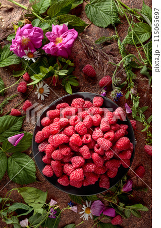 Summer still life with, raspberries, flowers and meadow grasses. 115065697