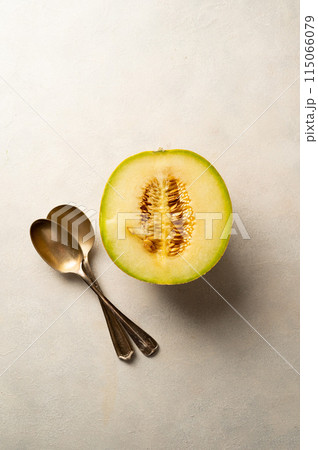 Cantaloupe, melon fruit slice over bright background.  115066079
