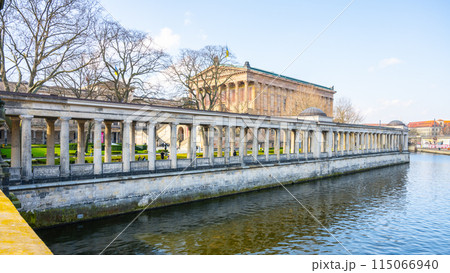 A serene view of the Old National Gallery located along the riverbank in Berlin, with classical architecture and clear skies. Germany A serene view of the Old National Gallery located along the riverbank in Berlin, with classical architecture and clear skies. Germany 115066940