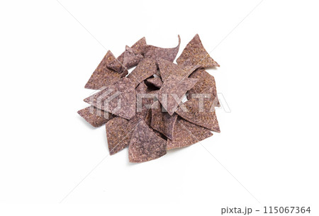 Isolated Organic Blue Corn Tortilla Chips On White Background. Healthy Crunchy Snack Seasoned With Sea Salt. Horizontal Plane. Top View Isolated Organic Blue Corn Tortilla Chips On White Background. Healthy Crunchy Snack Seasoned With Sea Salt. Horizontal Plane. Top View 115067364