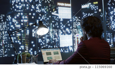 Organization president evaluating strategies for expanding company worldwide, appreciating urban center panorama from his headquarters. Effective director analyzes monthly earnings for progress. Organization president evaluating strategies for expanding company worldwide, appreciating urban center panorama from his headquarters. Effective director analyzes monthly earnings for progress. 115069160
