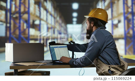 Exporting supervisor in charge of producing receipts for item administration, tracking delivery and transportation requirements. Manufacturing operator going over records for order submission. 115069224