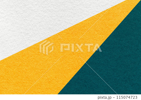 Texture of old craft white, yellow and emerald color paper background, macro. Vintage abstract teal cardboard 115074723