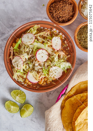 Pozole rojo, Mexican corn soup, traditional food in Mexico made with corn kernels and pork. Pozole rojo, Mexican corn soup, traditional food in Mexico made with corn kernels and pork. 115075642