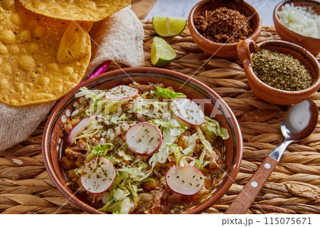 Pozole rojo, Mexican corn soup, traditional food in Mexico made with corn kernels and pork. 115075671