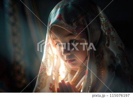A cute little Muslim girl prays, her small hands raised in devotion. The innocence and purity of a child faith. Generative AI. 115076197