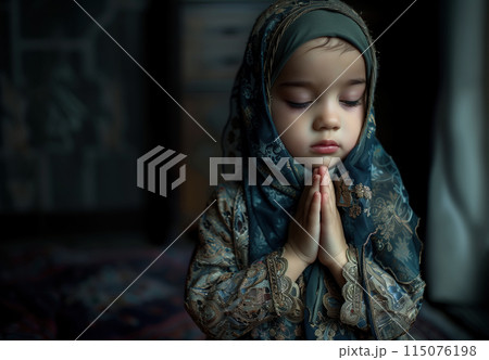 A cute little Muslim girl prays, her small hands raised in devotion. The innocence and purity of a child faith. Generative AI. 115076198