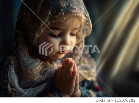 A cute little Muslim girl prays, her small hands raised in devotion. The innocence and purity of a child faith. Generative AI. 115076202