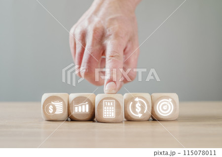 Payroll concept, Hand holding wooden block on desk with payroll icon on virtual screen. 115078011