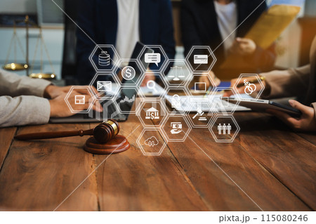 justice and law concept. team judge in a courtroom the gavel, working with digital tablet computer on wood table in sun light. justice and law concept. team judge in a courtroom the gavel, working with digital tablet computer on wood table in sun light. 115080246