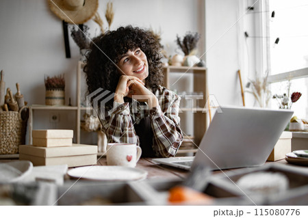 Happy female saleswoman waiting for customers. 115080776