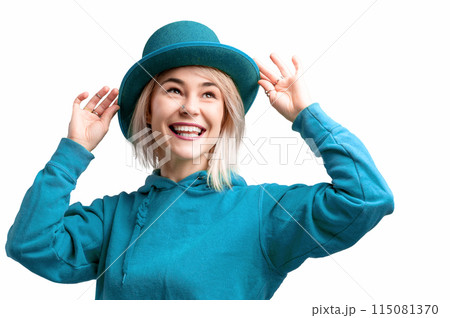 Smiling woman. Beautifu young woman wearing blue hat and in a blue sweatshirt. 115081370