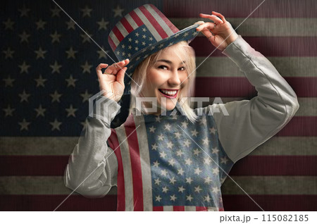 Woman wearing hat with american symbols. Beautiful beauty woman celebrating USA national traditional holiday. Woman wearing hat with american symbols. Beautiful beauty woman celebrating USA national traditional holiday. 115082185