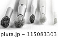 Brush set for artist on white wooden background on sunlight 115083303