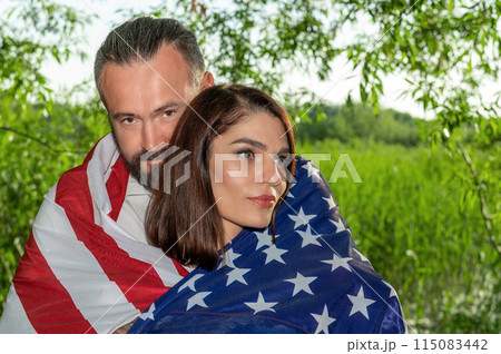 Couple with american flag. USA Independence Day Celebration Couple with american flag. USA Independence Day Celebration 115083442