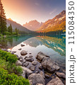 View of a lake and mountain range at sunset 115084350