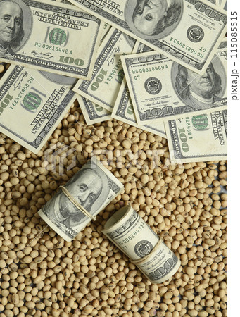 Dollars banknotes and coins and soy beans,oleaginous commoditi value concept. Dollars banknotes and coins and soy beans,oleaginous commoditi value concept. 115085515