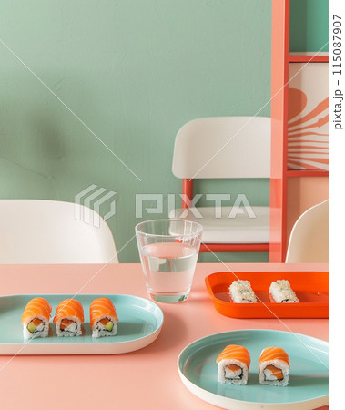 Product photo three plates of sushi and rolls on table in a restaurant or kitchen. 115087907