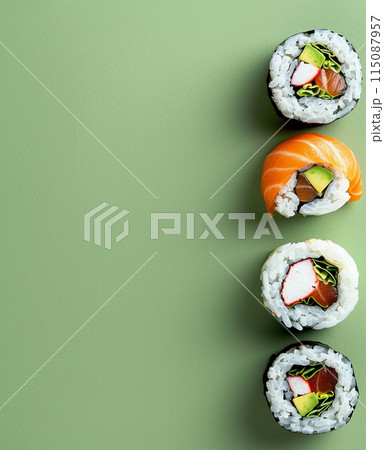 Set of sushi rolls top view over soft green background 115087957